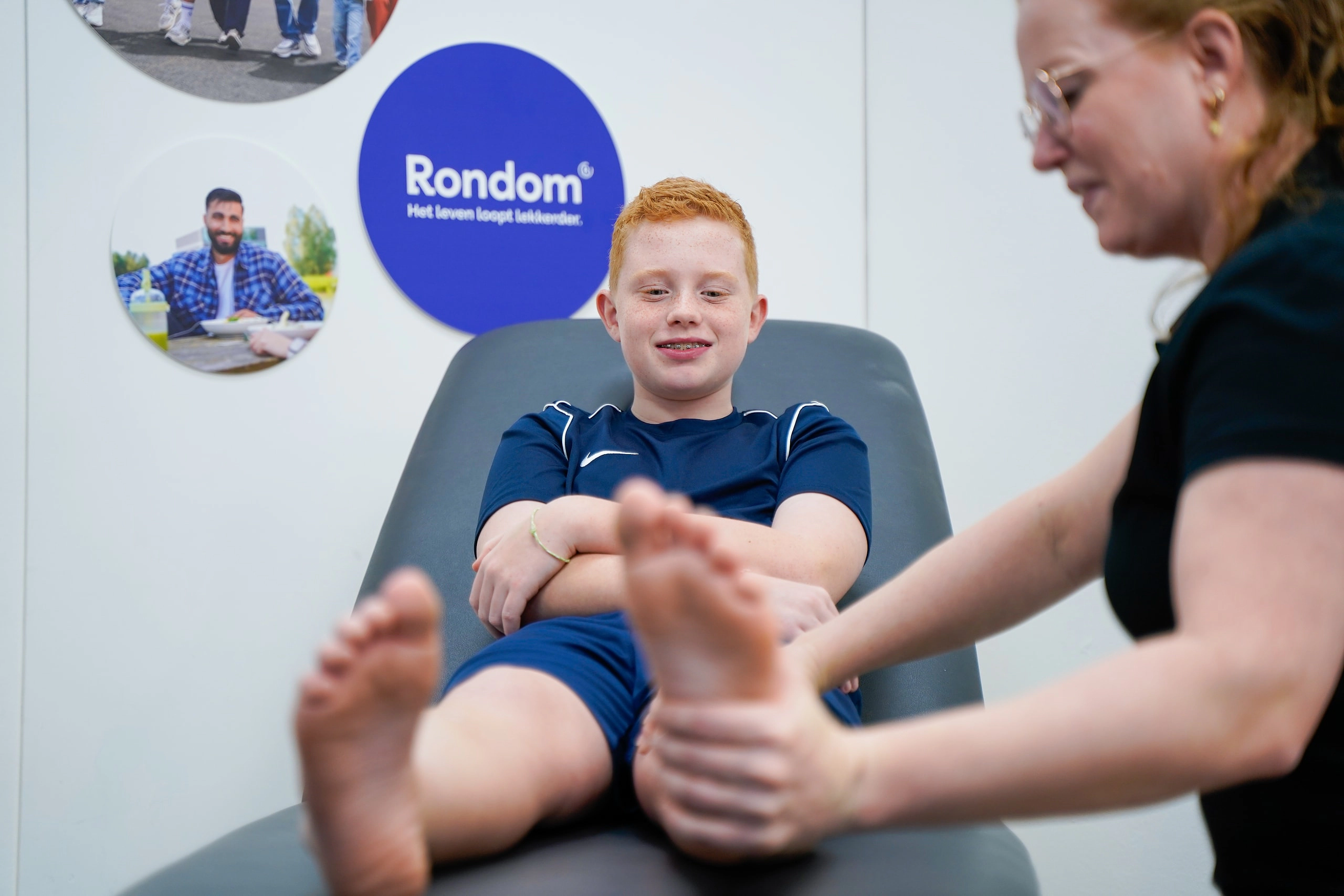 A podiatrist treats a foot